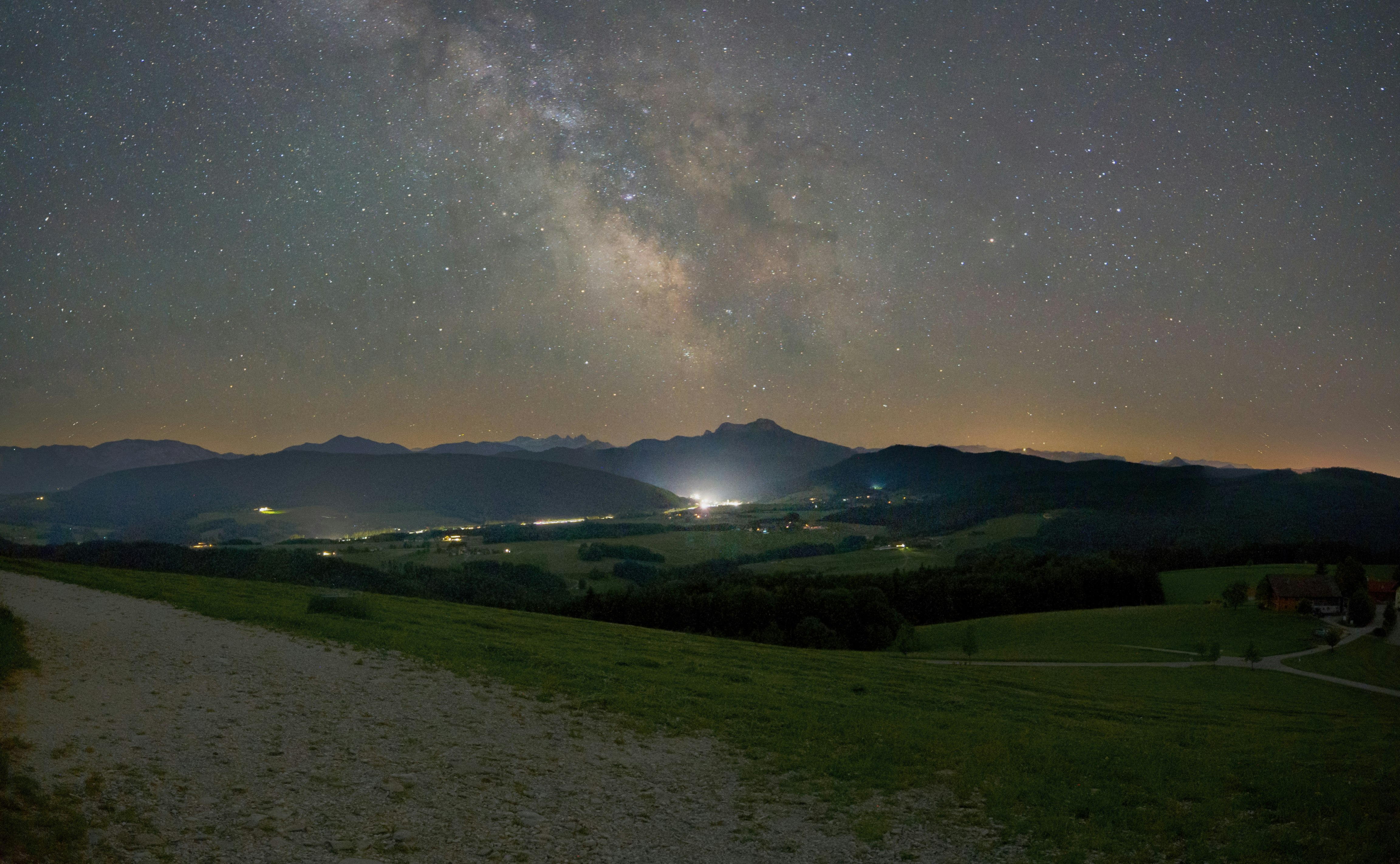 green grass field under starry night